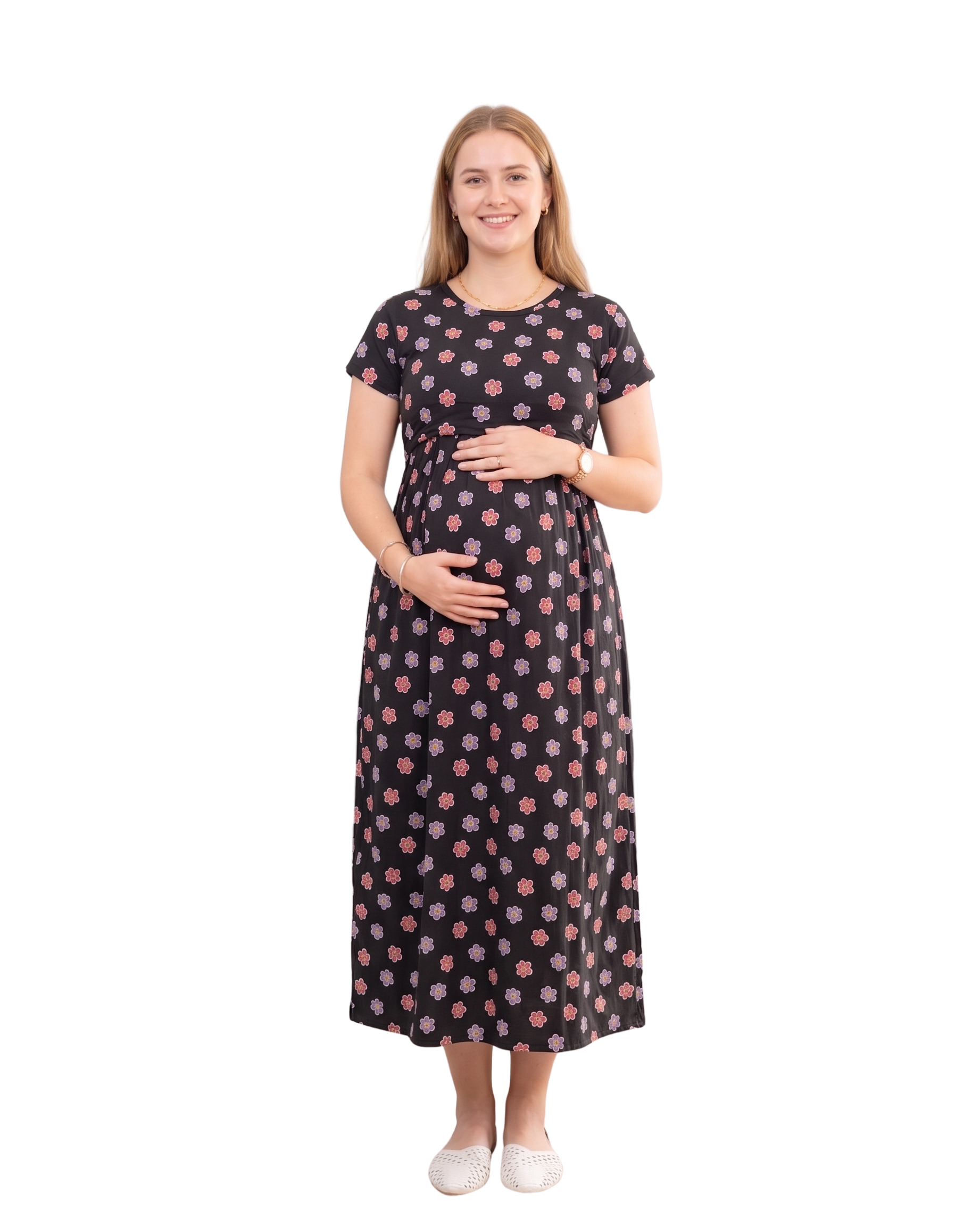 Pregnant woman wearing a black maternity dress with a floral print
